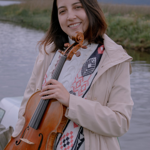 Laura E.