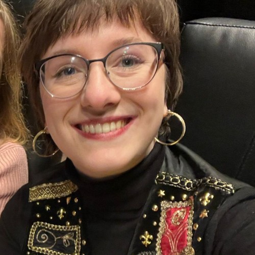 Laura E.