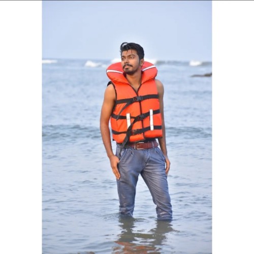 Dinesh B.
