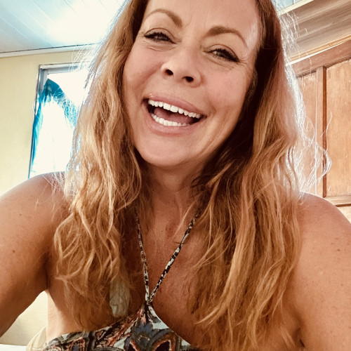 Laura E.