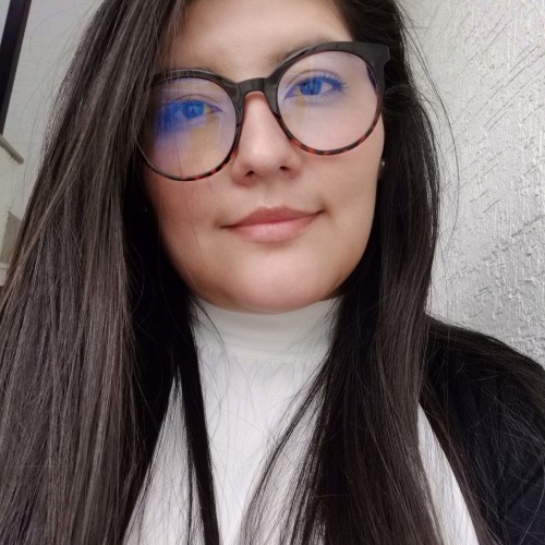 Laura E.