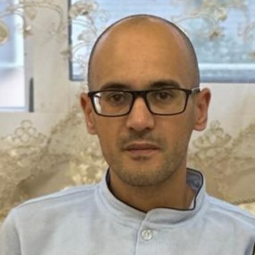 Mustafa E.